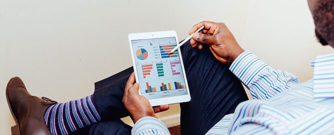 Man Working on Tablet with Stylus